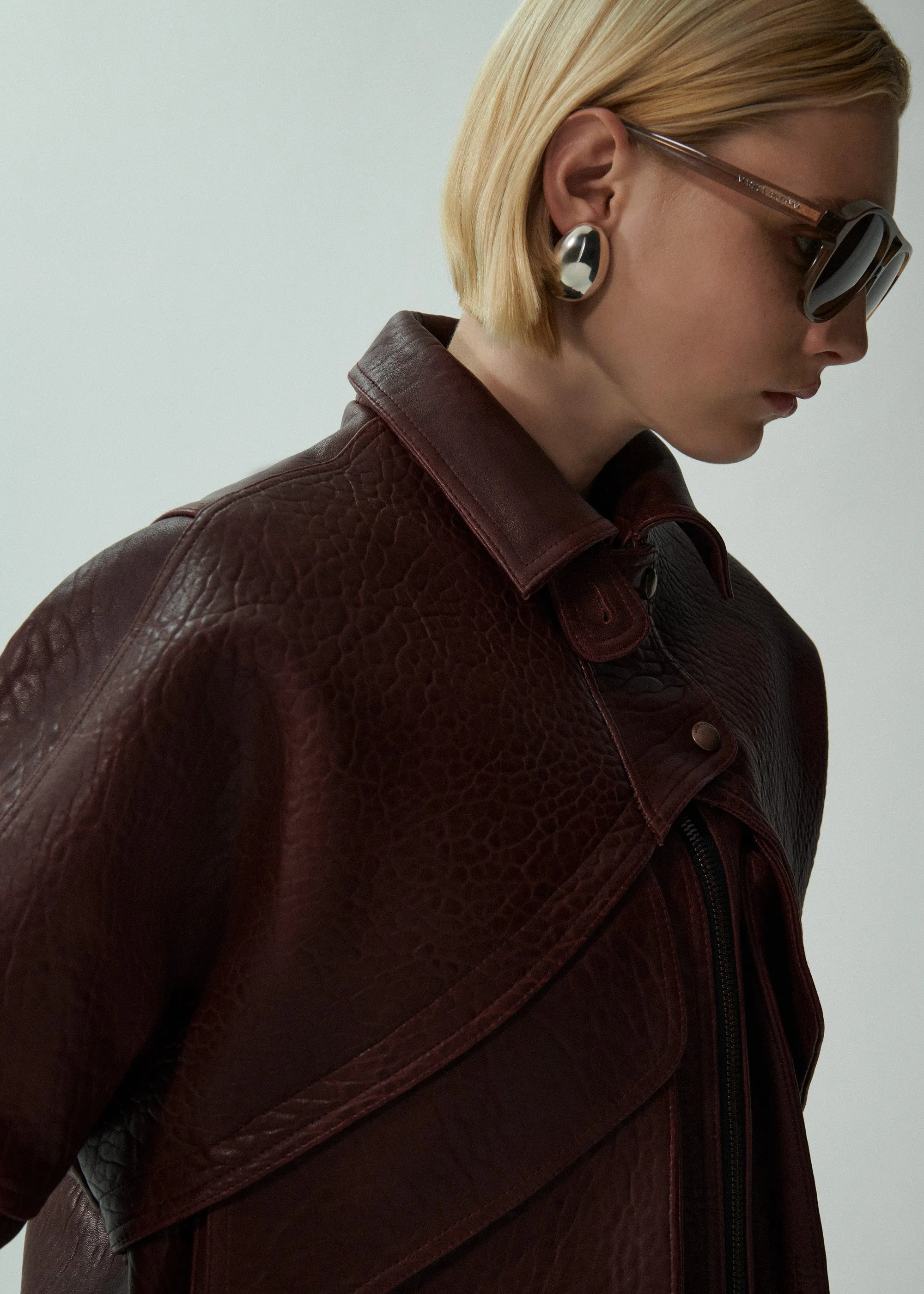 Vintage leather bomber jacket in embossed burgundy